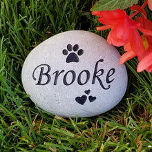 Load image into Gallery viewer, pet memorial stone.  Personalized with a name, paw print and hearts.  Natural river rock garden memorial or pet gravestone