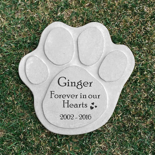 Personalized concrete paw print pet memorial stone for a dog, engraved